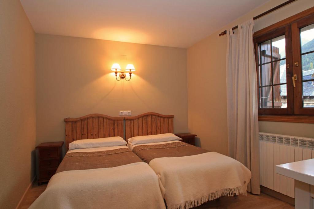 Postel nebo postele na pokoji v ubytování Hotel-Aparthotel El Reyno