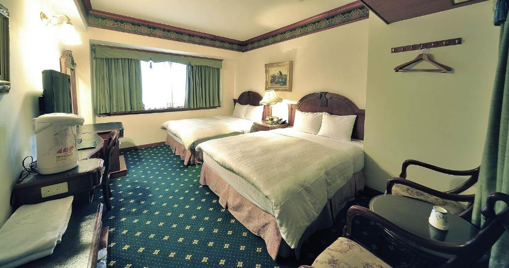 Postel nebo postele na pokoji v ubytování KaRo Hotel