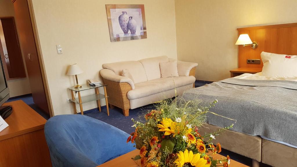 Postel nebo postele na pokoji v ubytování Hotel Vier Linden