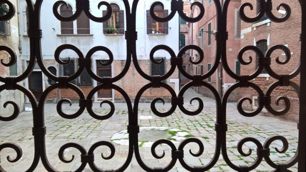 a view of a wrought iron fence in front of a street at Cà Formosa in Venice