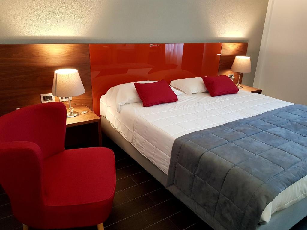 Postel nebo postele na pokoji v ubytování Hotel Sandalia