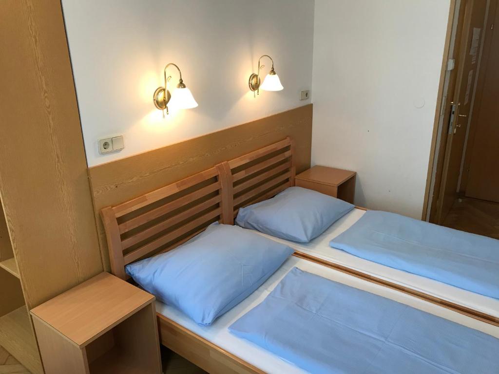 Postel nebo postele na pokoji v ubytování Hotel Pribitzer