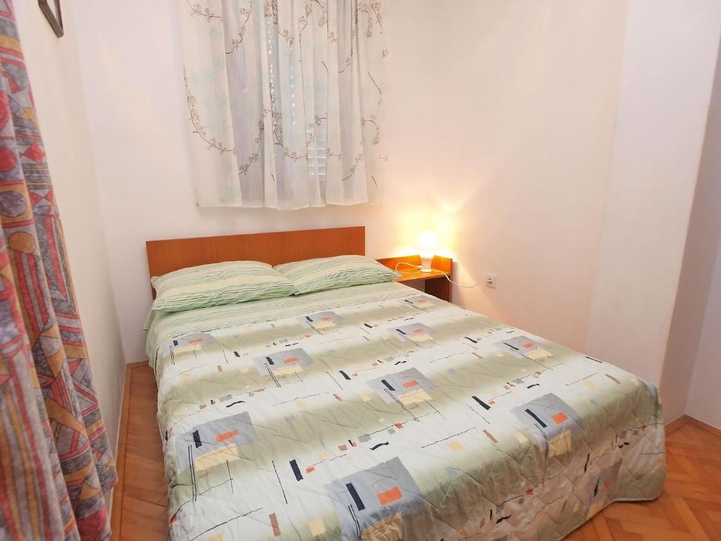 Łóżko lub łóżka w pokoju w obiekcie Apartments Ivan 41