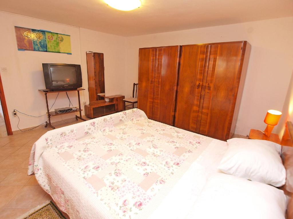 Łóżko lub łóżka w pokoju w obiekcie Apartments Ivan 41