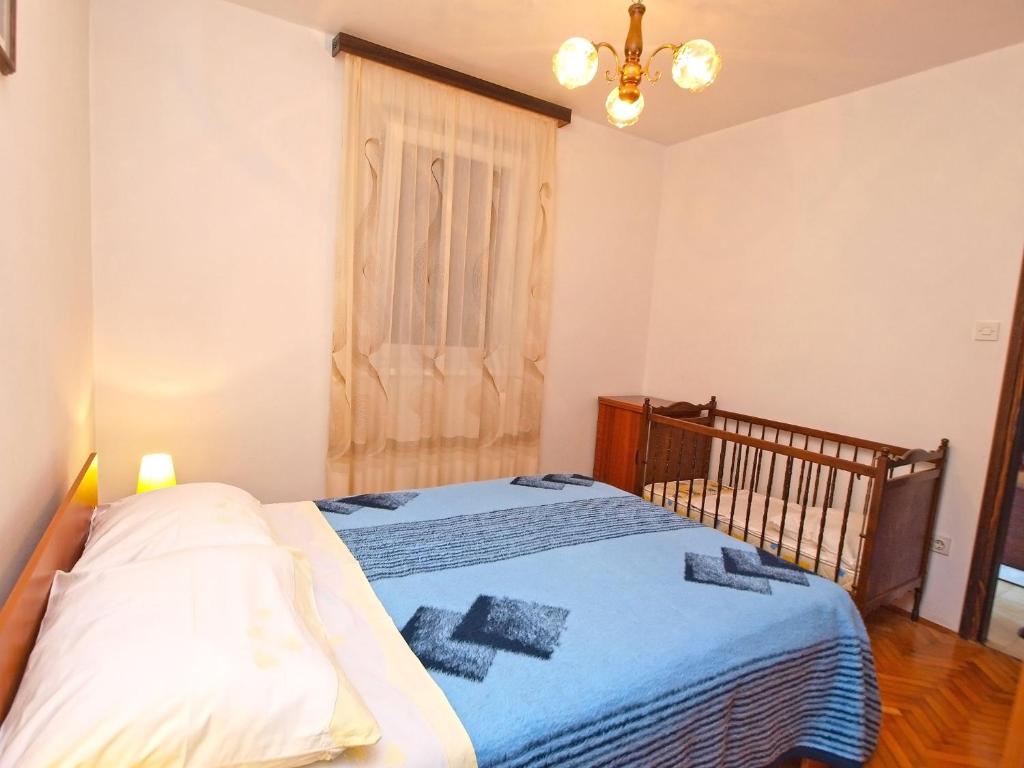 Łóżko lub łóżka w pokoju w obiekcie Apartments Ivan 41