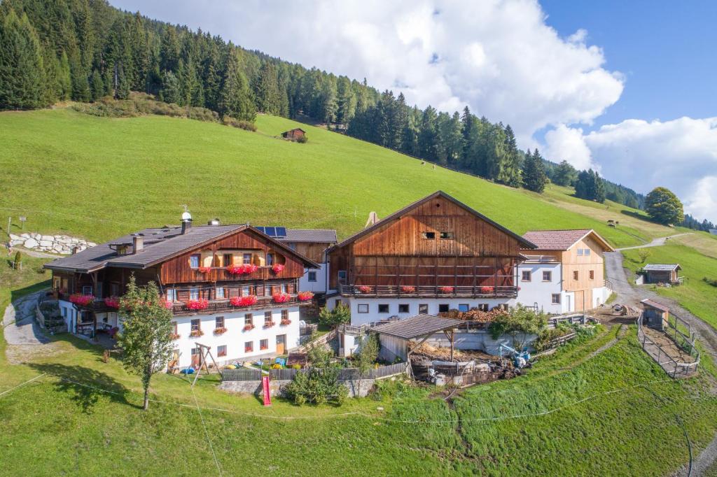 an aerial view of a building on a hill at Kerschbaumhof in San Candido