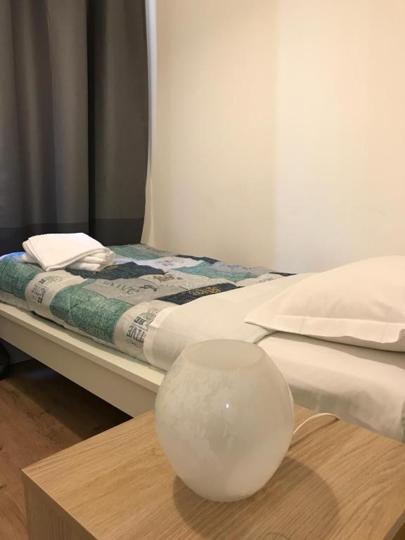 En eller flere senge i et værelse på Loreto Elite Milano