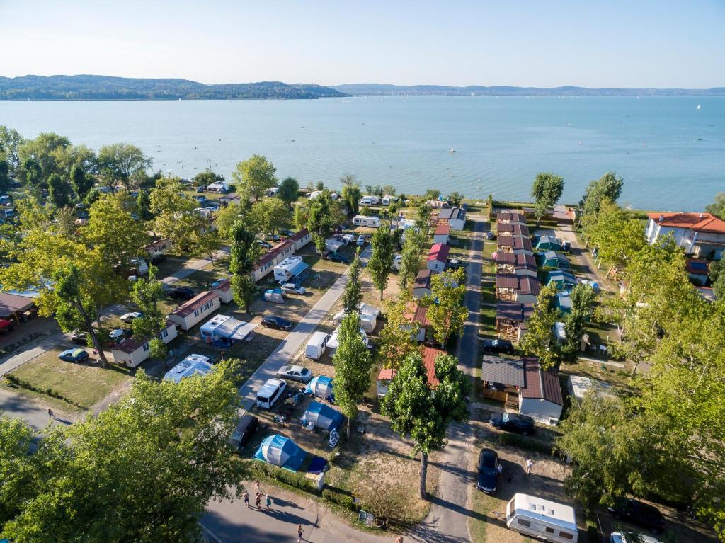 an aerial view of a parking lot next to the water at Mirabella Camping in Zamárdi