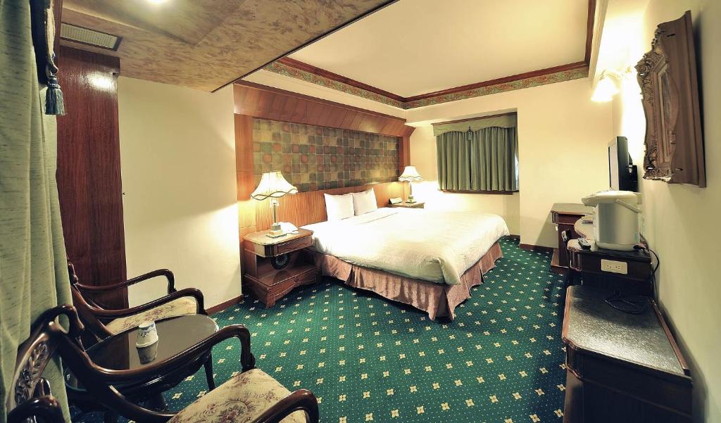 Postel nebo postele na pokoji v ubytování KaRo Hotel