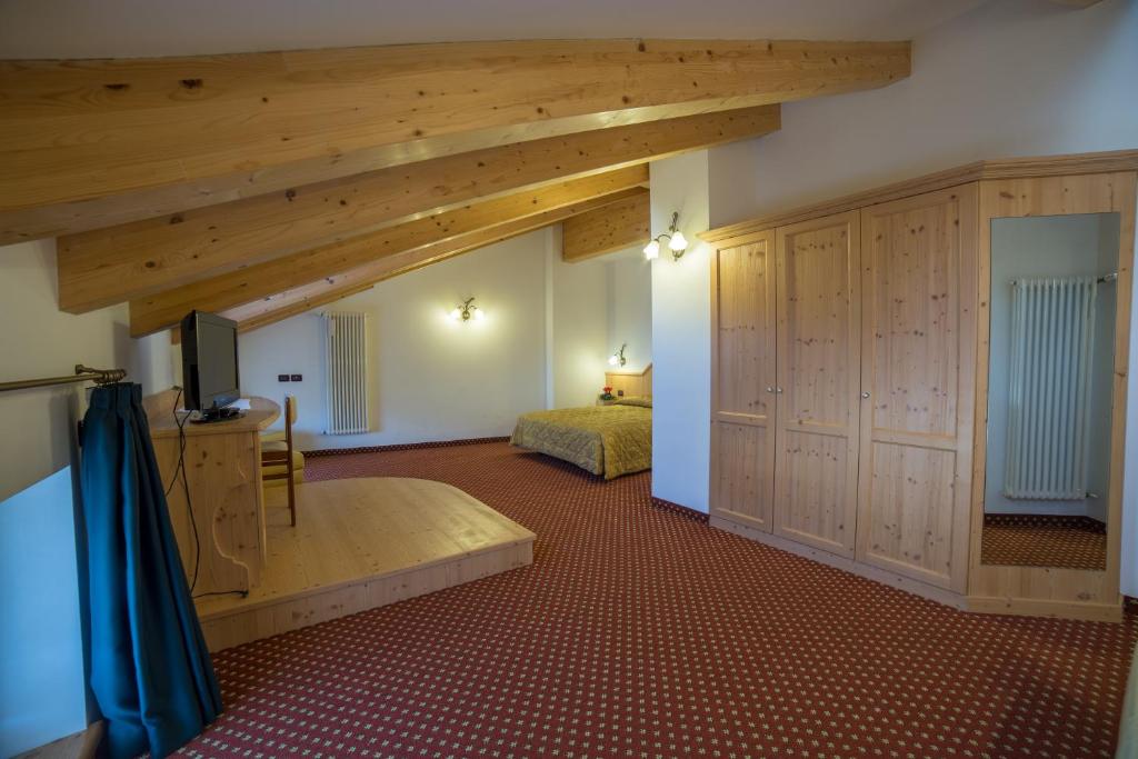 Postel nebo postele na pokoji v ubytování Hotel Bertoldi