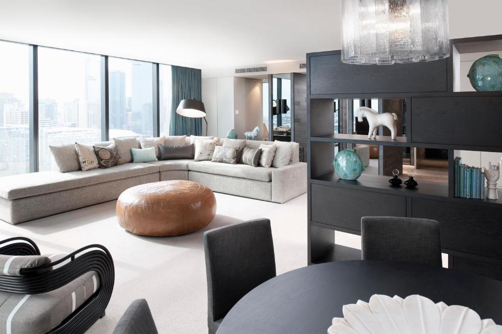 a living room with a couch and a table at Crown Metropol Melbourne in Melbourne