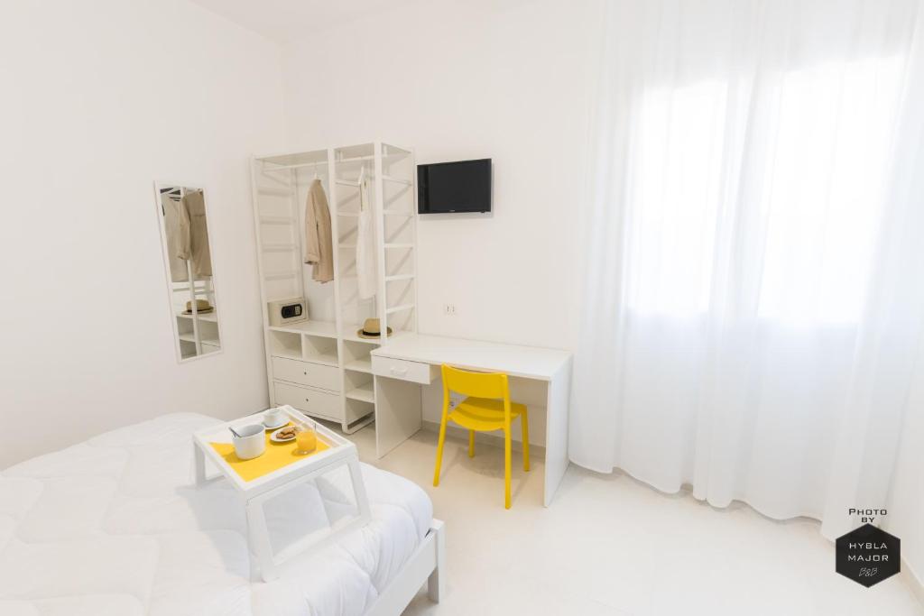 Postel nebo postele na pokoji v ubytování Hybla Major B&B