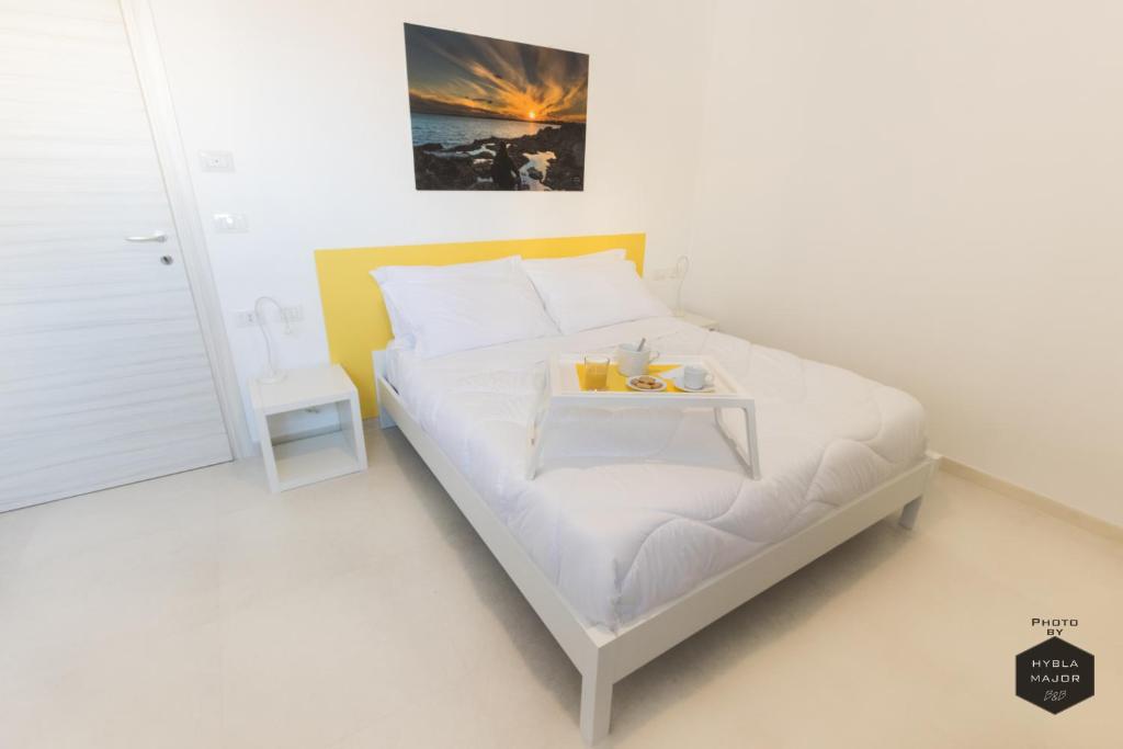 Postel nebo postele na pokoji v ubytování Hybla Major B&B