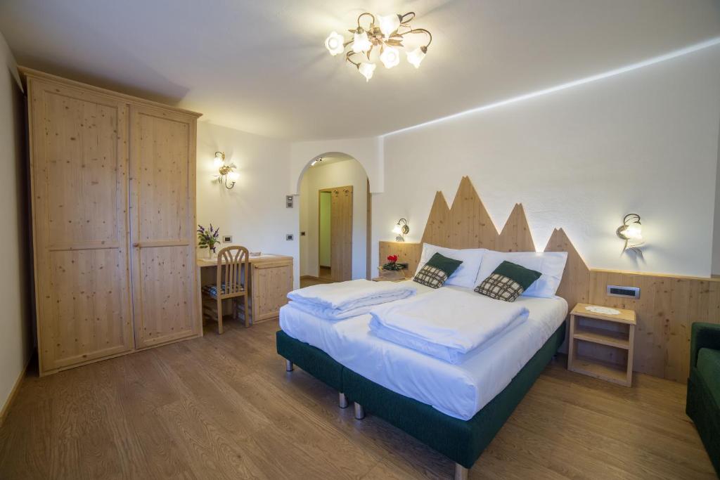 Postel nebo postele na pokoji v ubytování Hotel Bertoldi