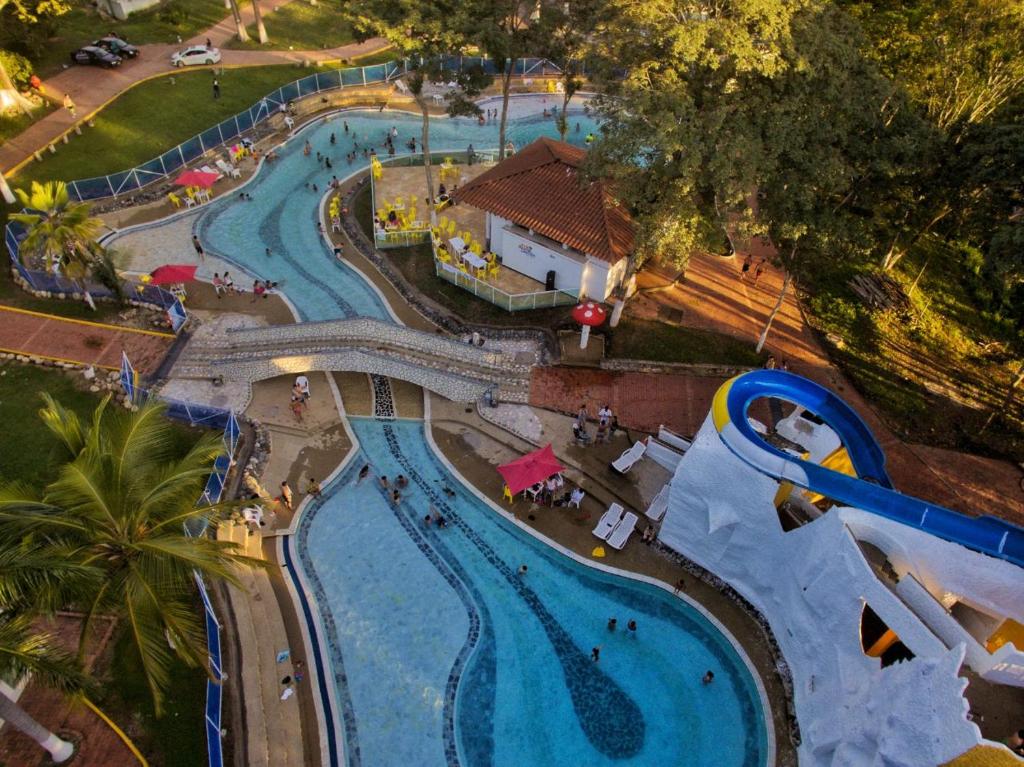 an overhead view of a pool at a water park at Hotel Hacienda Campestre in Melgar