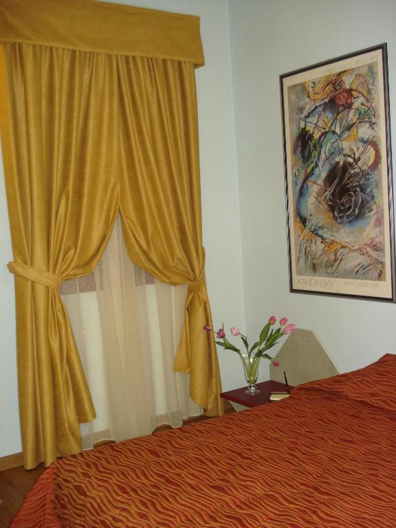 Postel nebo postele na pokoji v ubytování Hotel Maxim