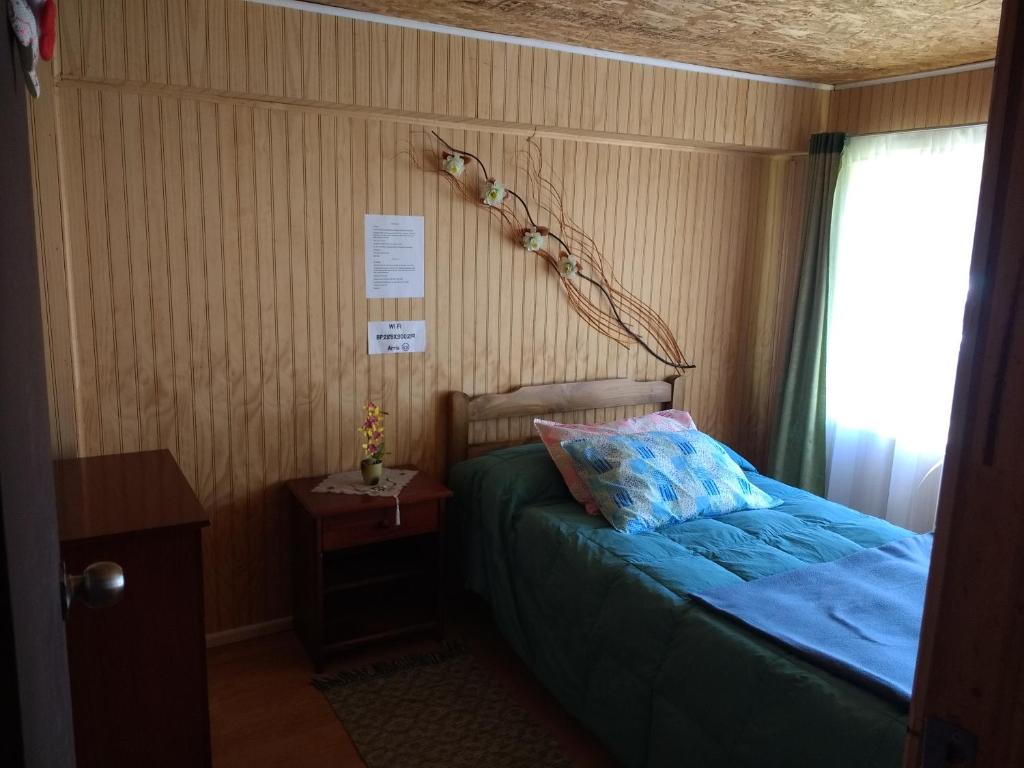 Postel nebo postele na pokoji v ubytování "Mi Hostal Tu Casa" Hostal Familiar SOLO EMPRESAS, TURISTAS y VIAJEROS Espacio para BICICLETAS y MOTOS