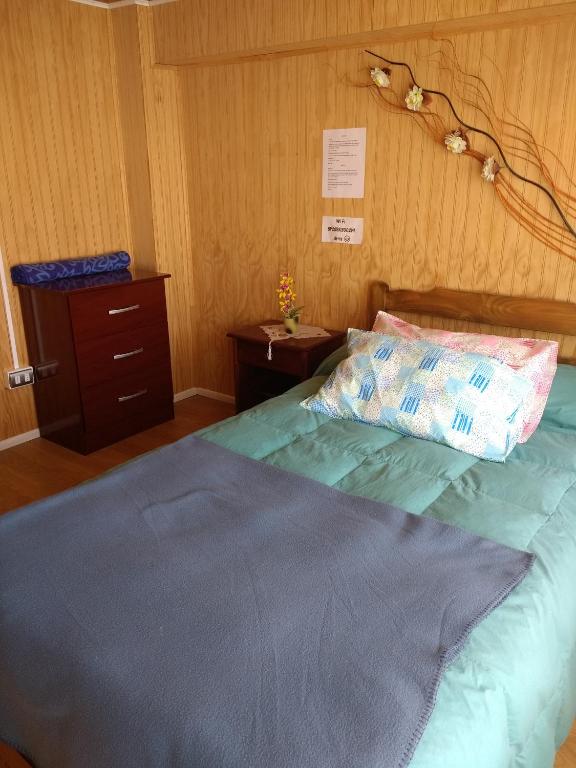 Postel nebo postele na pokoji v ubytování "Mi Hostal Tu Casa" Hostal Familiar SOLO EMPRESAS, TURISTAS y VIAJEROS Espacio para BICICLETAS y MOTOS