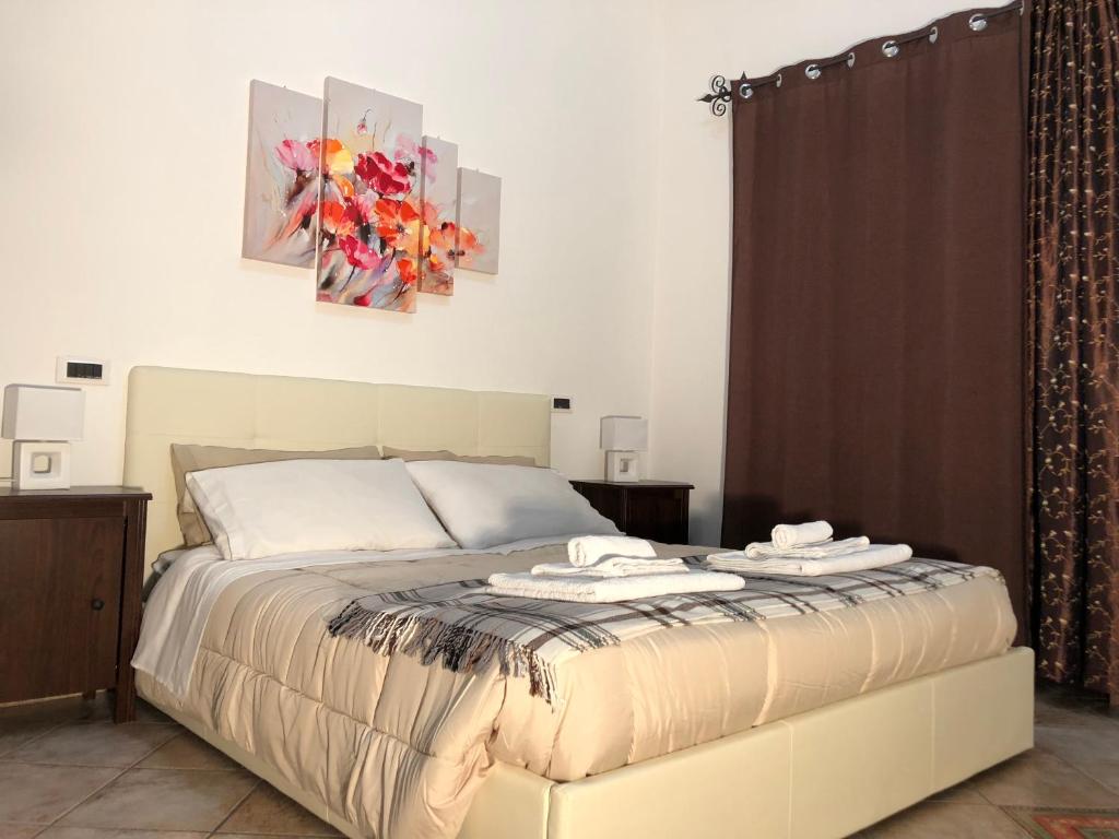 Postel nebo postele na pokoji v ubytování B&B Villa Loriana