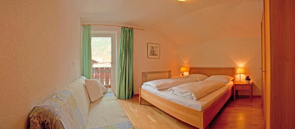 Postel nebo postele na pokoji v ubytování Haus Schlossblick