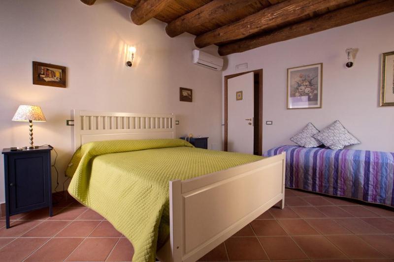 a bedroom with two beds in a room at B&B Corte Catalana in Marigliano