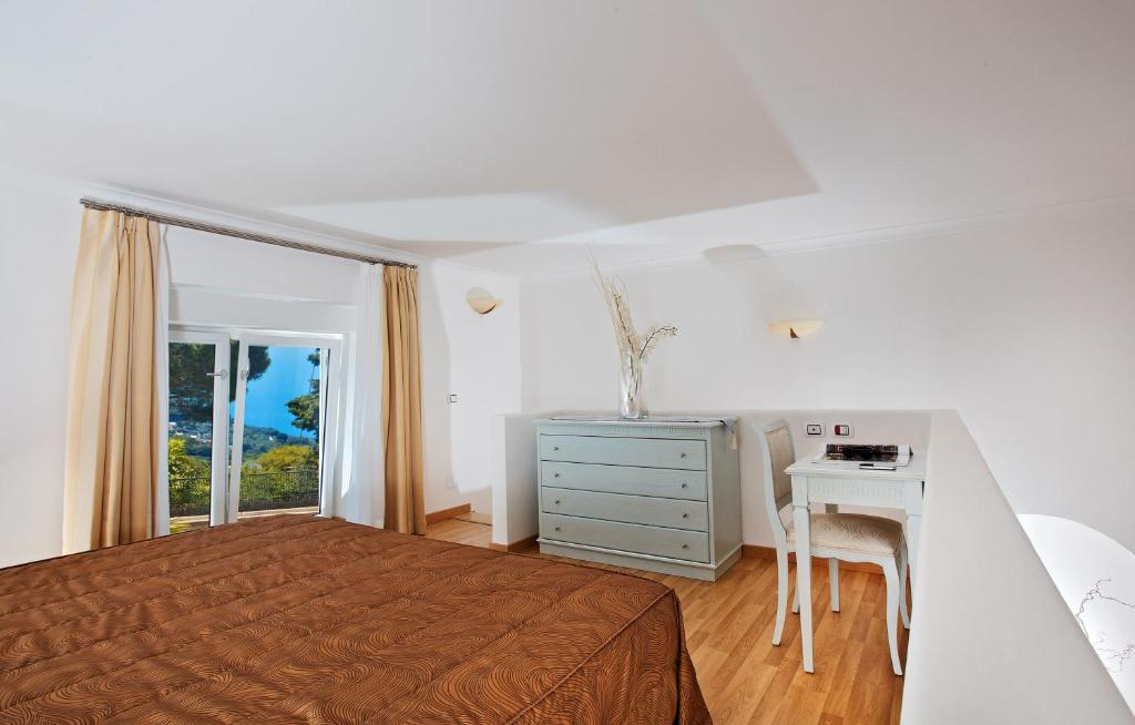 Postel nebo postele na pokoji v ubytování Hotel Villa Ceselle