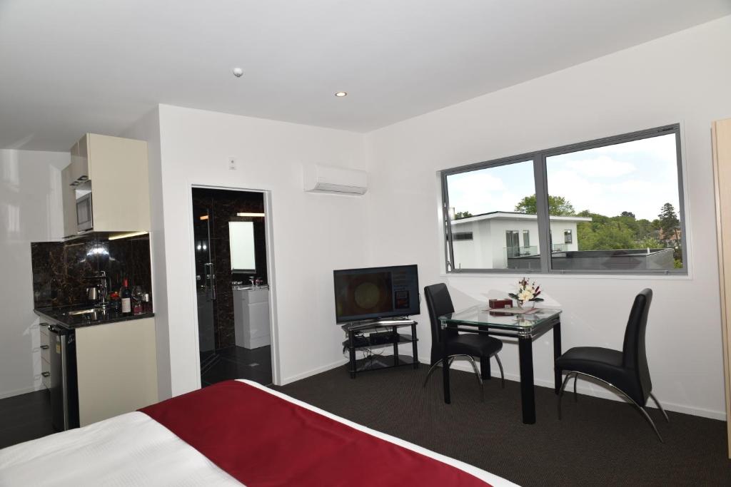 Kuchyň nebo kuchyňský kout v ubytování Bealey Plaza Motel
