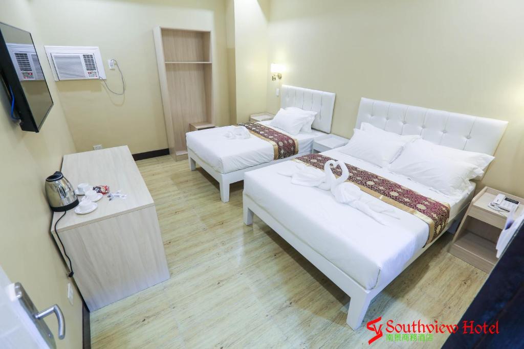 Postel nebo postele na pokoji v ubytování Southview Hotel