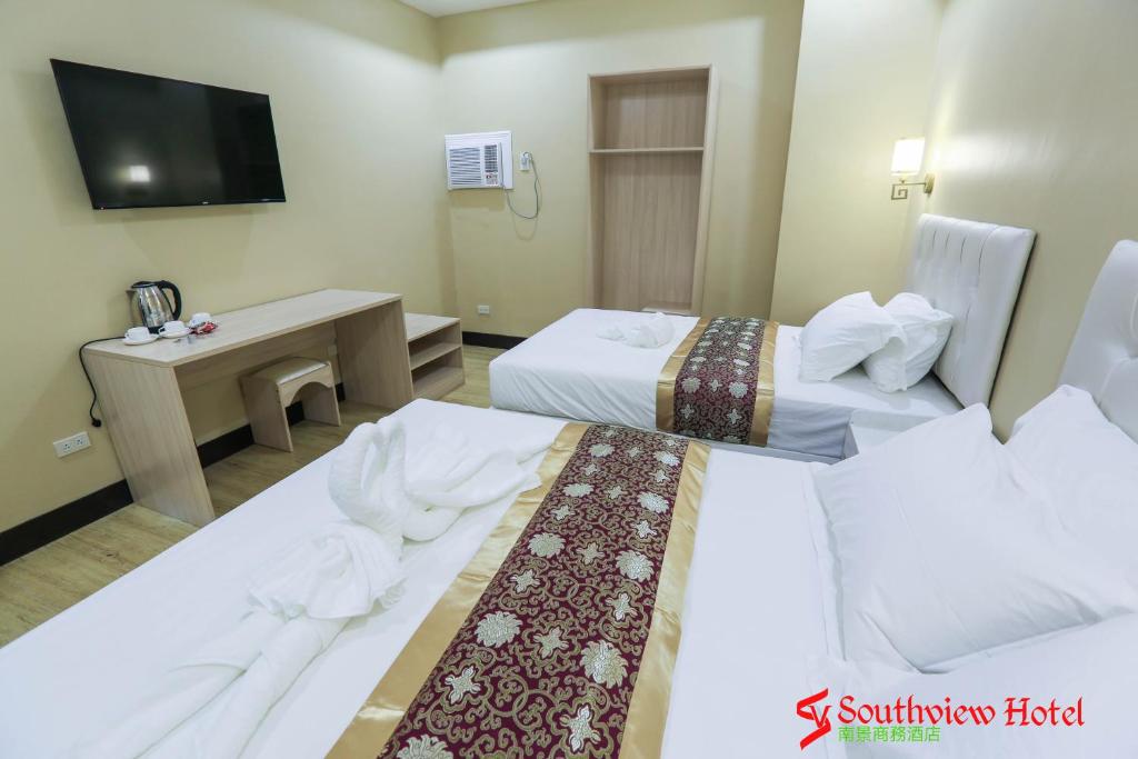 Postel nebo postele na pokoji v ubytování Southview Hotel