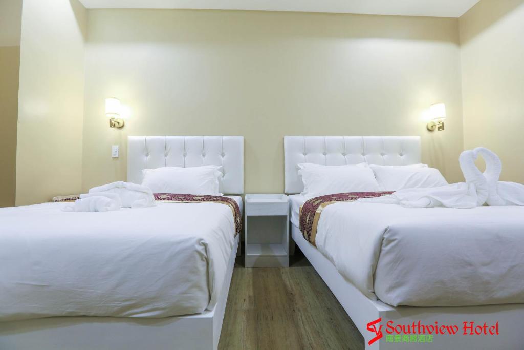Postel nebo postele na pokoji v ubytování Southview Hotel