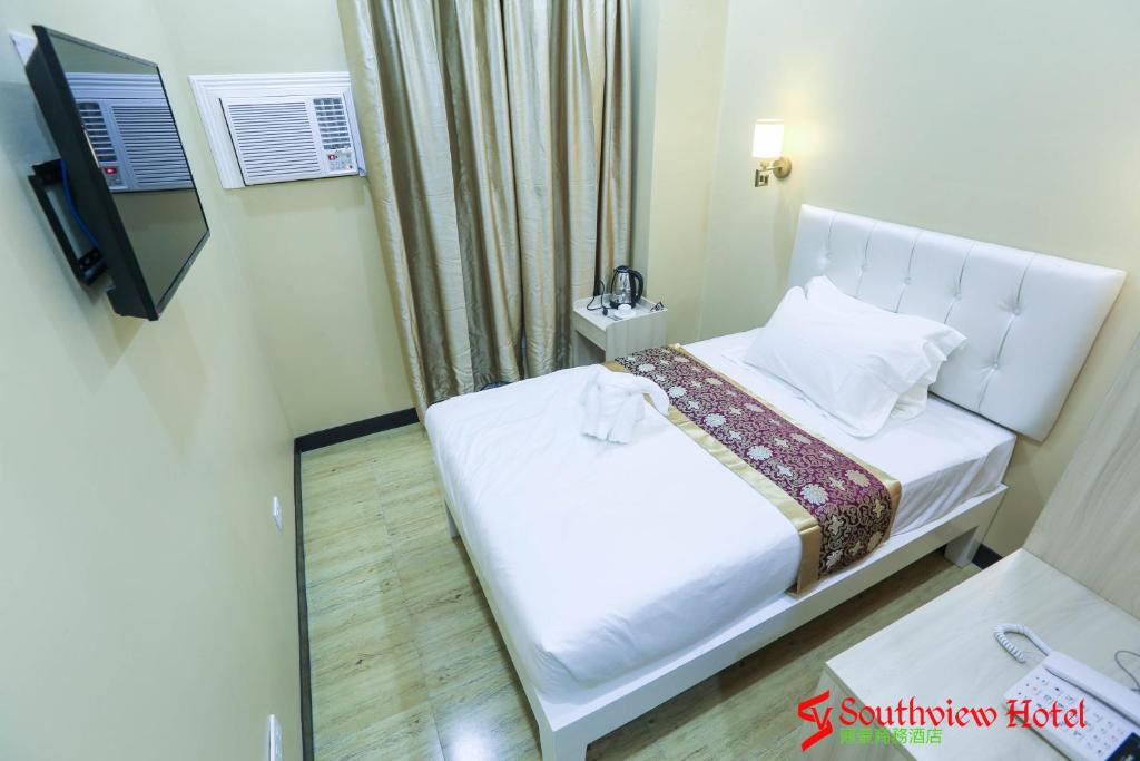 Postel nebo postele na pokoji v ubytování Southview Hotel