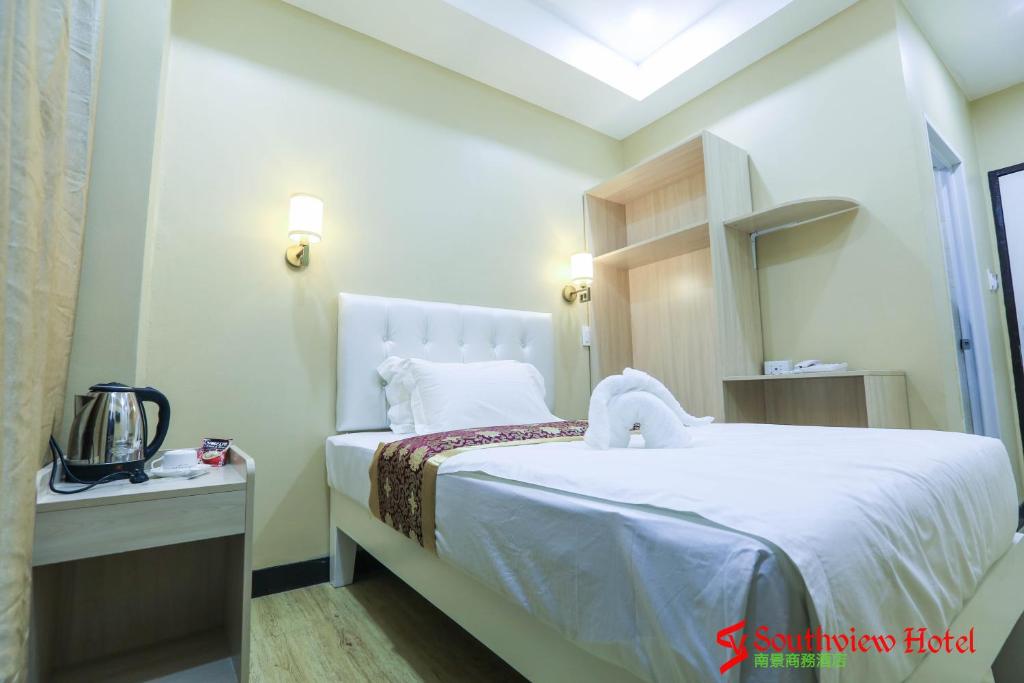 Postel nebo postele na pokoji v ubytování Southview Hotel