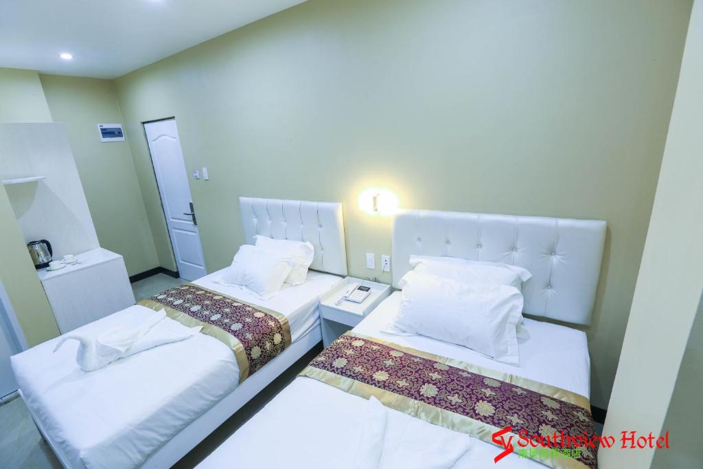Postel nebo postele na pokoji v ubytování Southview Hotel