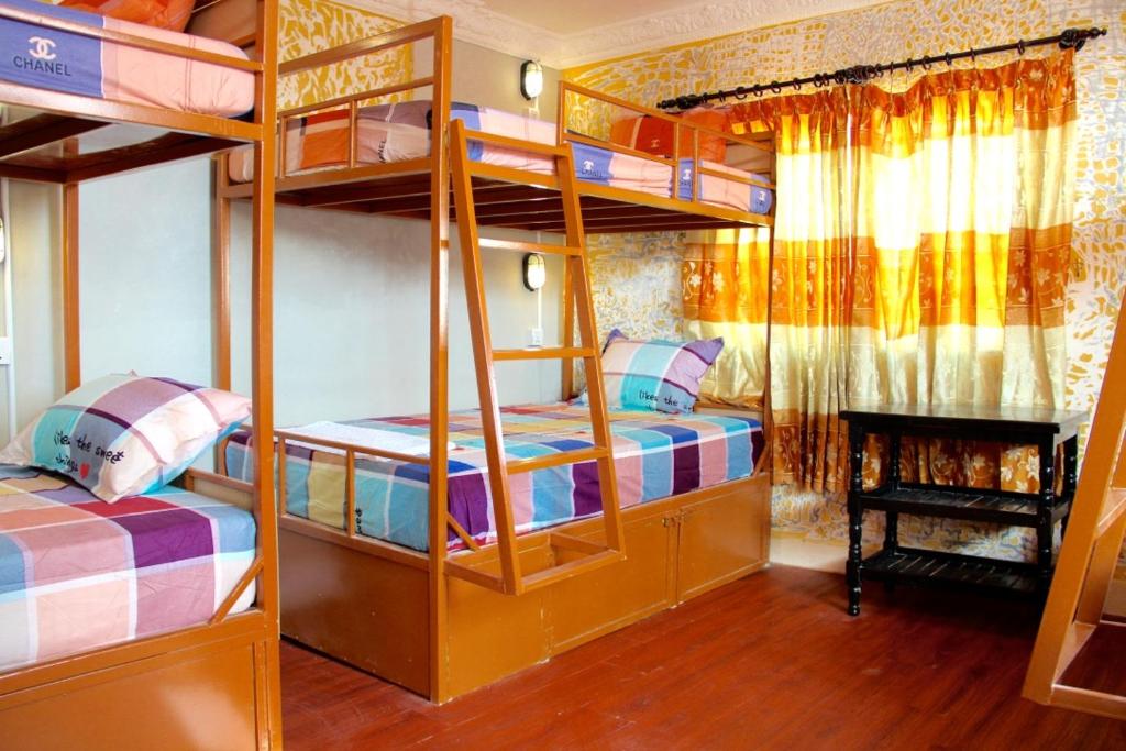 Postel nebo postele na pokoji v ubytování Pich Guesthouse