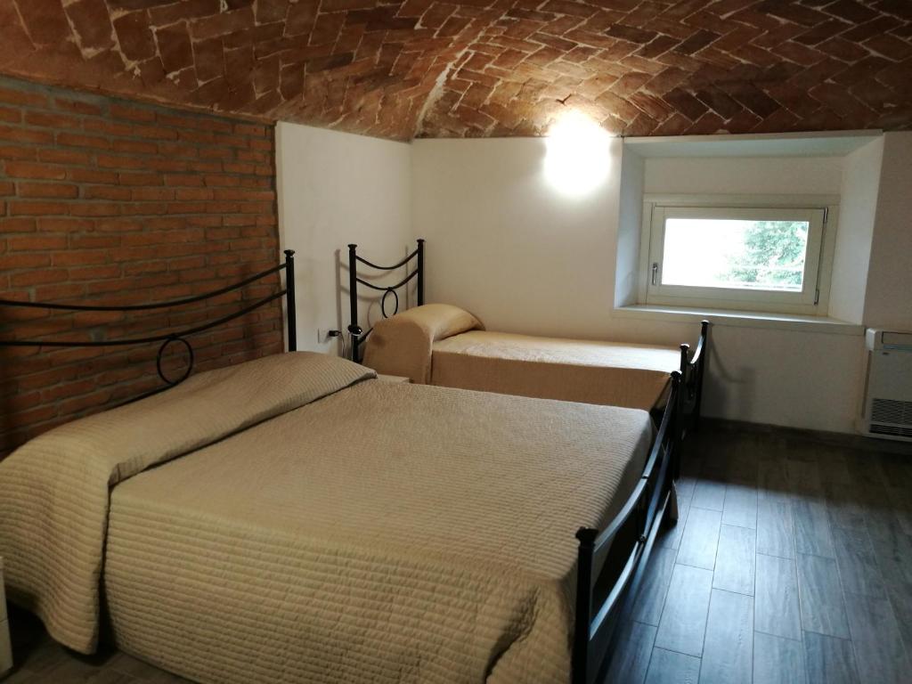 Postel nebo postele na pokoji v ubytování B&B Sant'Antonio De Foris