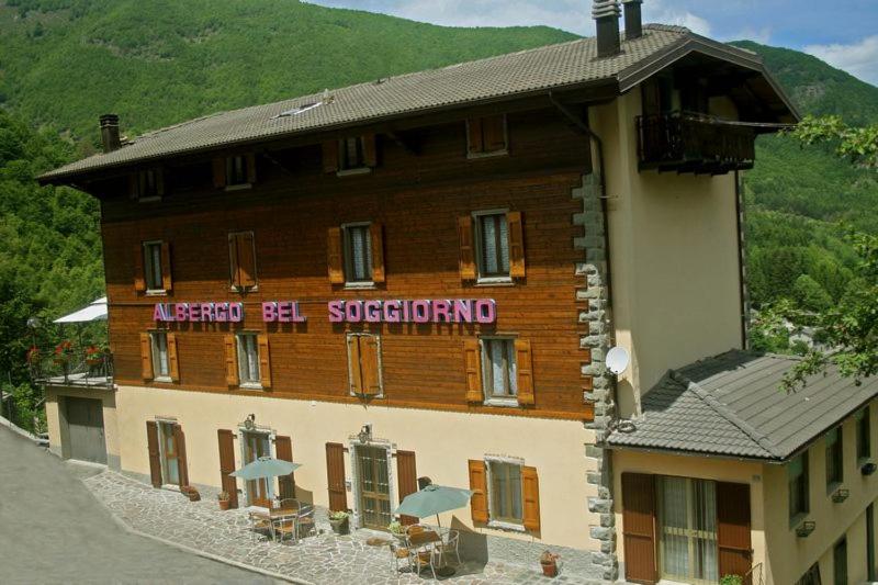 a building with a sign on the side of it at Albergo Bel Soggiorno in Fiumalbo