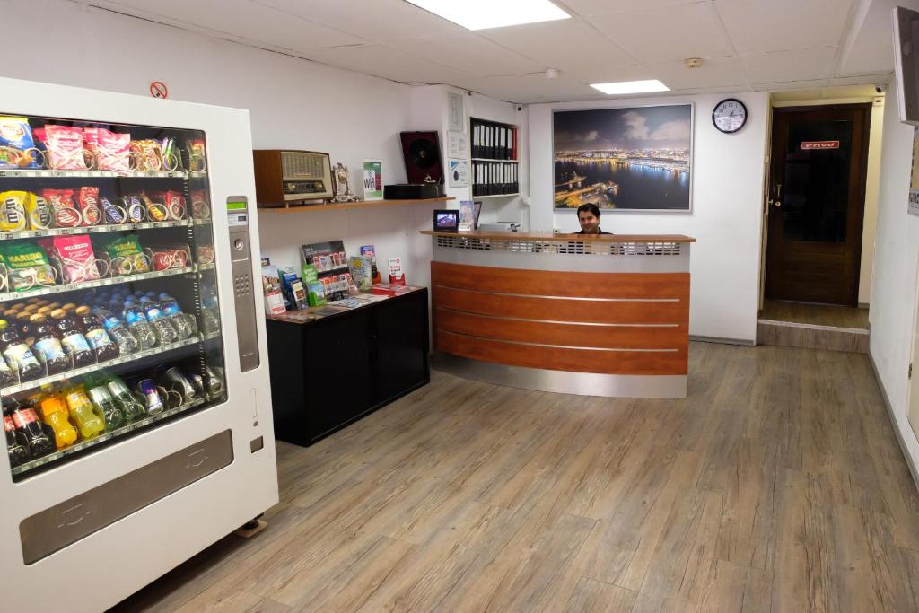 a pharmacistacist at a counter in a store with a pharmacyacistacistacist at Budget Hotel Ben in Amsterdam