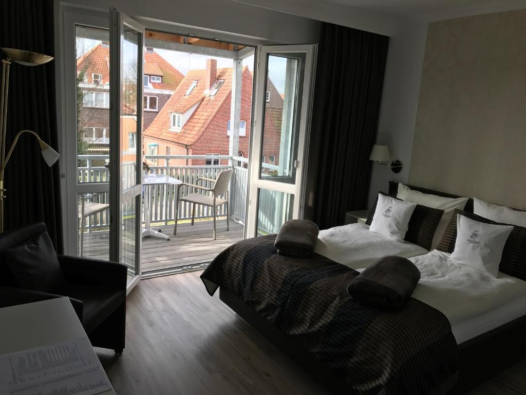 Postel nebo postele na pokoji v ubytování Hotel De Insulåner