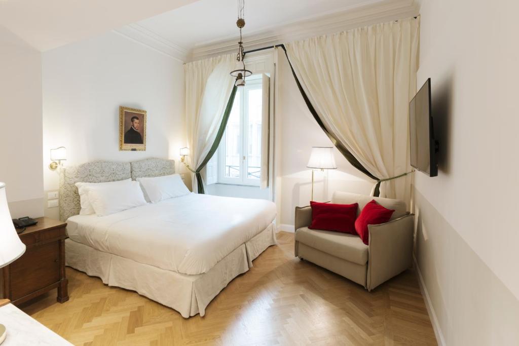 A bed or beds in a room at Relais Donna Lucrezia
