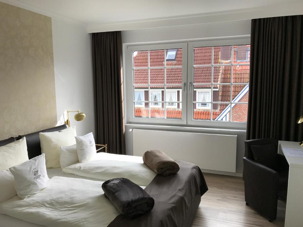 Postel nebo postele na pokoji v ubytování Hotel De Insulåner