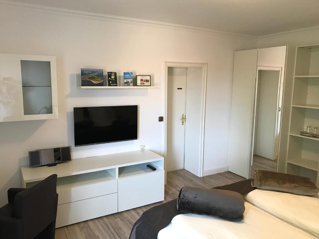 TV a/nebo společenská místnost v ubytování Hotel De Insulåner
