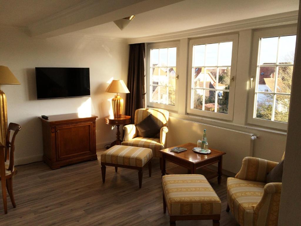 TV a/nebo společenská místnost v ubytování Hotel De Insulåner