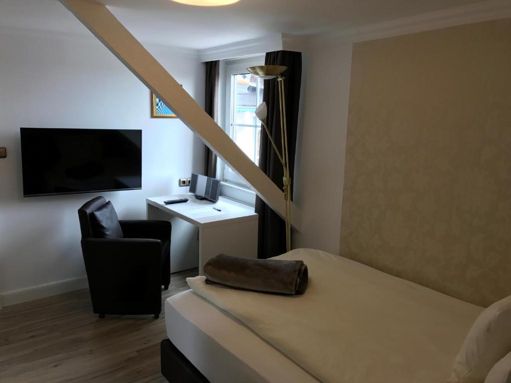 TV a/nebo společenská místnost v ubytování Hotel De Insulåner