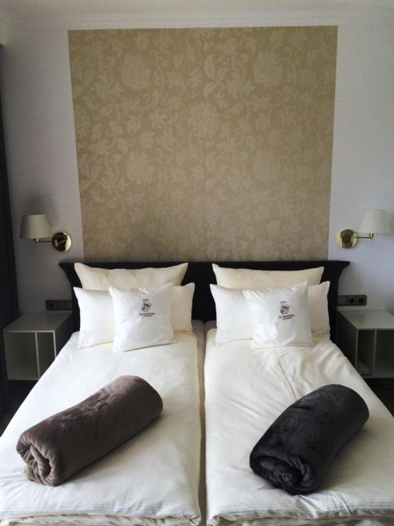 Postel nebo postele na pokoji v ubytování Hotel De Insulåner