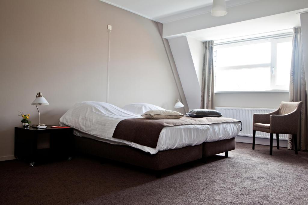 Postel nebo postele na pokoji v ubytování Hotel en Restaurant de Stripe