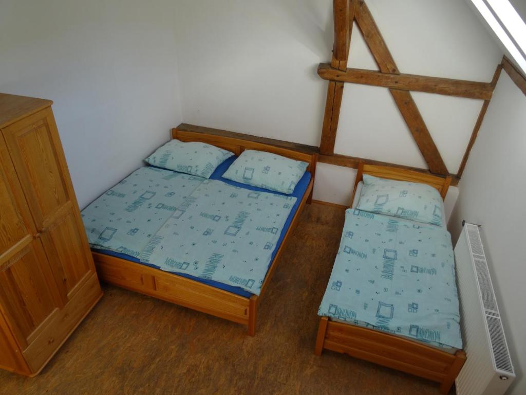 Postel nebo postele na pokoji v ubytování U Nás - Apartmán Zajíc