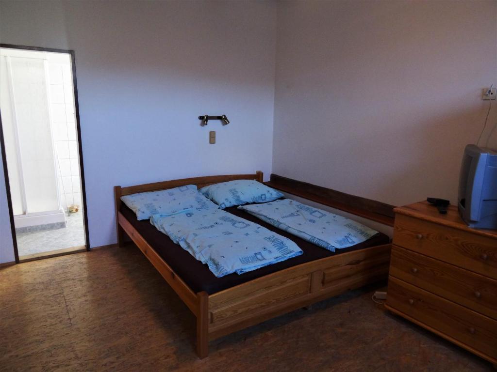 Postel nebo postele na pokoji v ubytování U Nás - Apartmán Zajíc