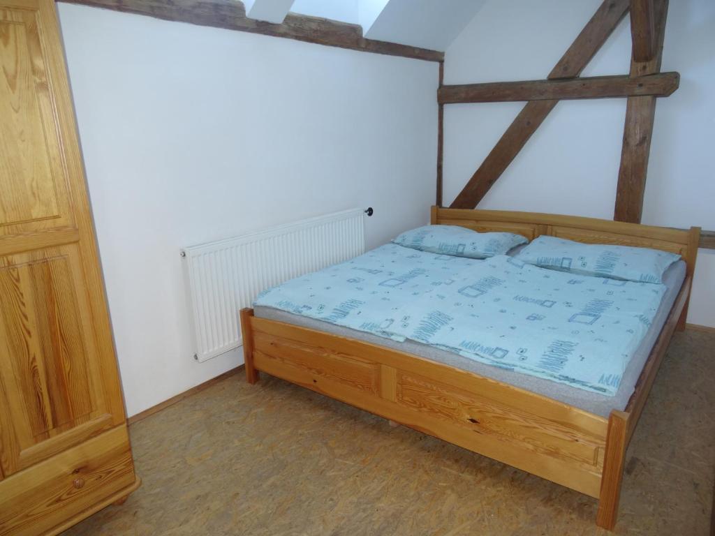 Postel nebo postele na pokoji v ubytování U Nás - Apartmán Zajíc