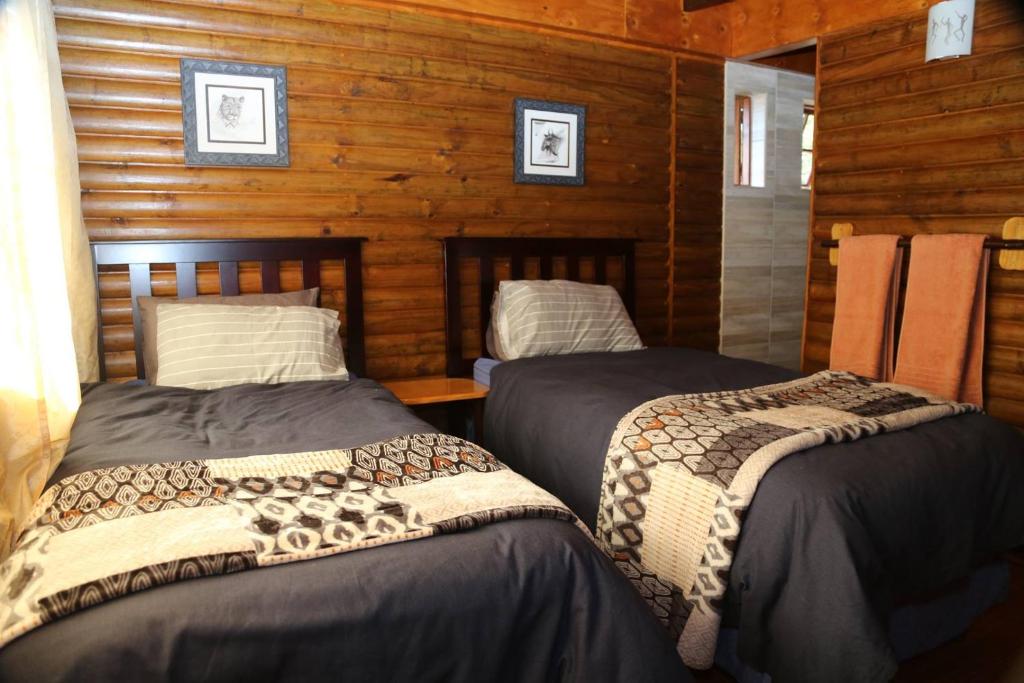 Tempat tidur dalam kamar di Horseshoe Game Reserve