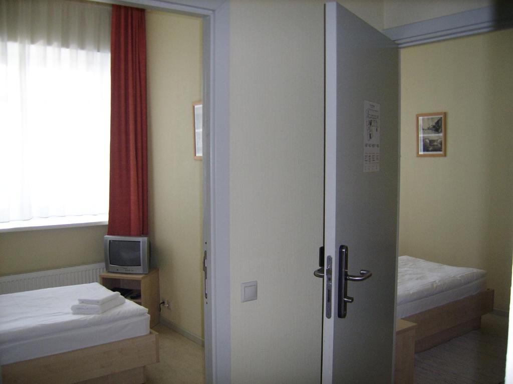 Postel nebo postele na pokoji v ubytování Kolonna Hotel Rēzekne